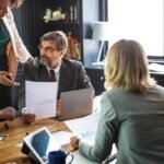 Reviewing report in meeting