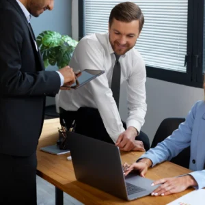 Team collaborating on laptop