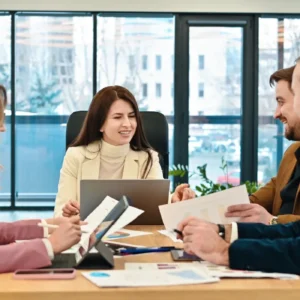 Colleagues collaborating at desk